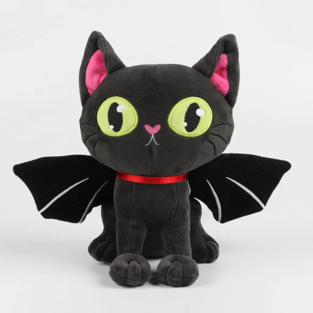 Black cat plush toy with green eyes, pink ears, and red collar on a white background