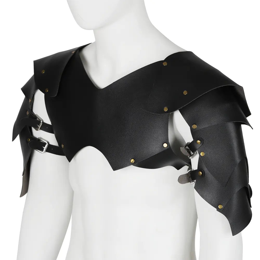 Black leather shoulder piece with gold studs on a mannequin against a white background