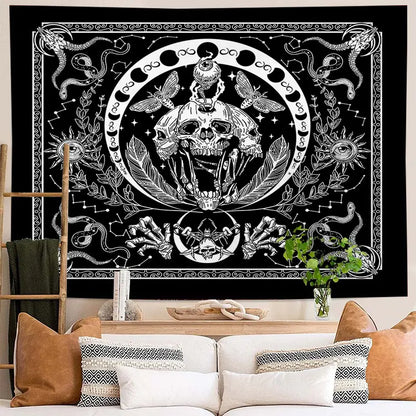 Decorative tapestry with skull and snake design on a wall above a sofa.