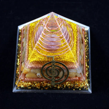 Decorative item with geometric design and central emblem on a black background