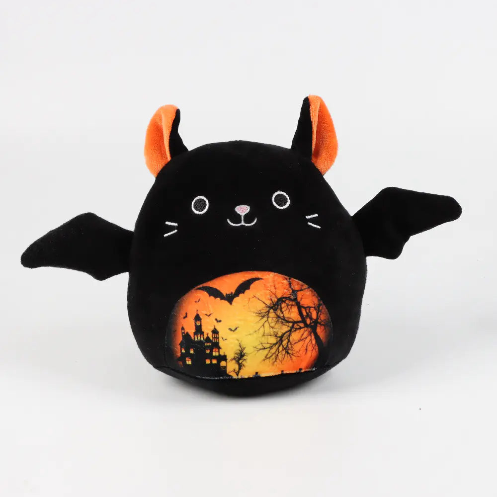 Black plush toy with Halloween design on a white background