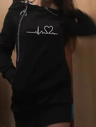Person wearing a black hoodie with a white design on a plain background
