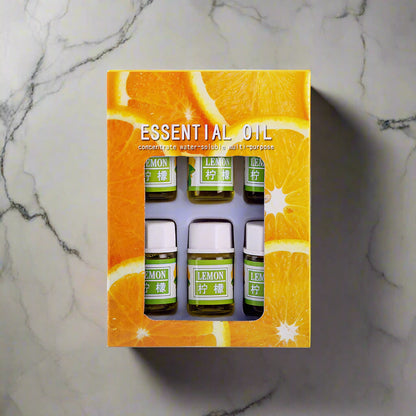 Set of lemon essential oil bottles in a decorative box with orange design