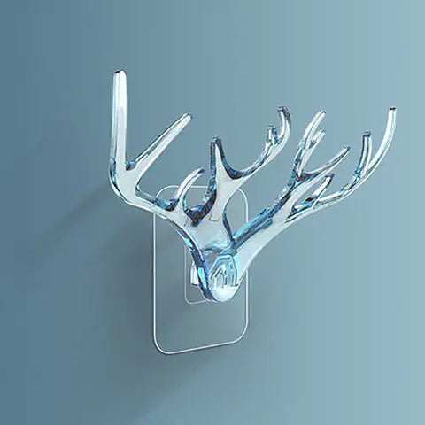 Decorative wall hook shaped like deer antlers on a gray background