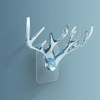 Decorative wall hook shaped like deer antlers on a gray background
