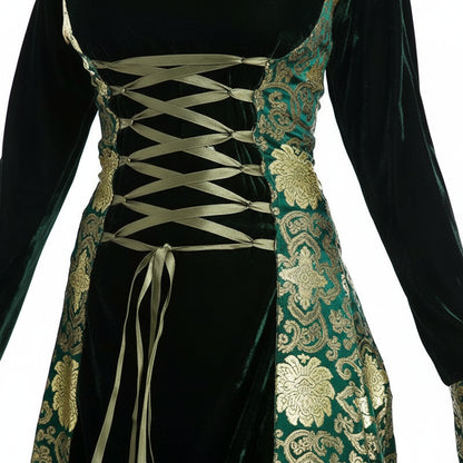 Woman wearing a green and black medieval-style dress on a white background