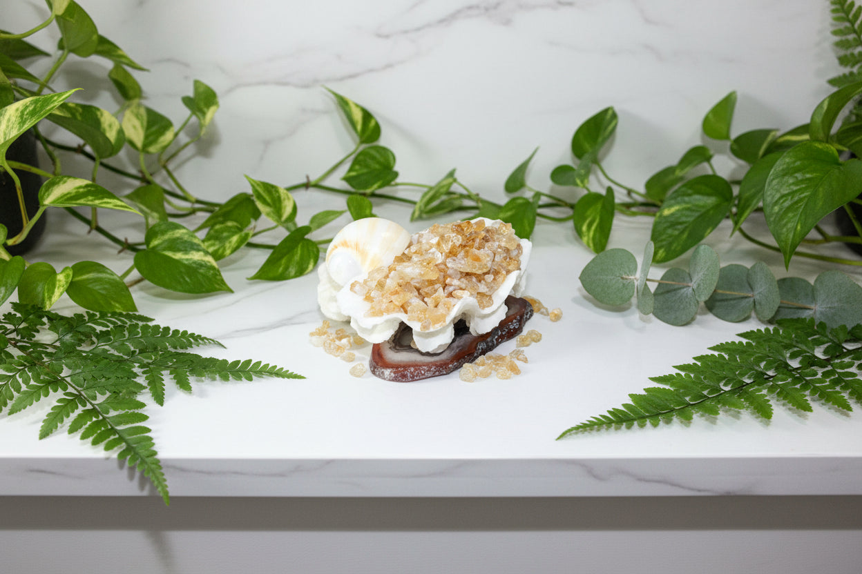 Dessert with whipped cream and caramel bits on a white plate
