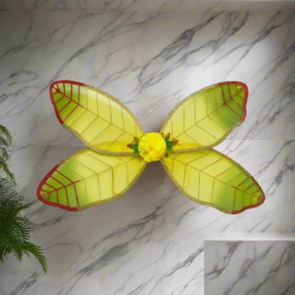 Yellow fairy wings with red edges on a white background