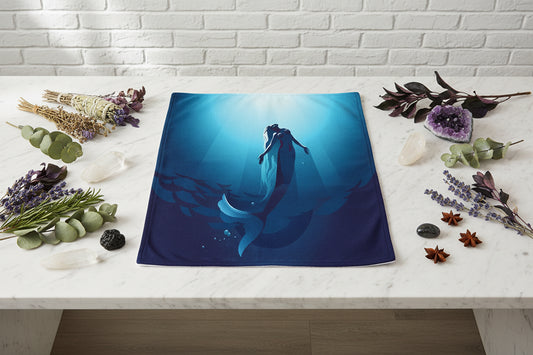 Mermaid silhouette in an underwater scene on a blue fabric background