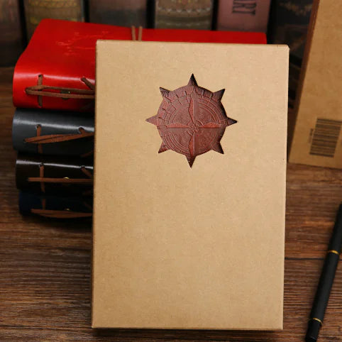Kraft paper notebook with a leather embossed design on a wooden surface