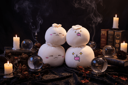 Two plush toys resembling snowmen with cartoon faces on a checkered chair.
