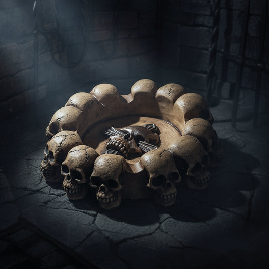 Decorative item with skulls and a central design on a white background