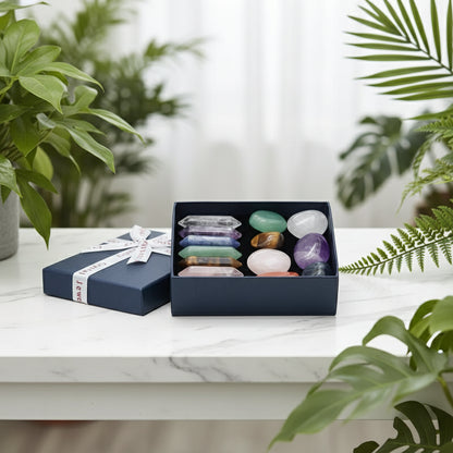 Box of colorful crystals with a ribbon on a white background