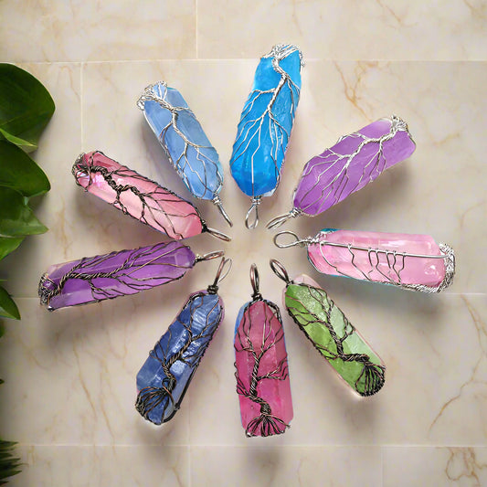 Colorful crystal pendants arranged in a circle on a white background