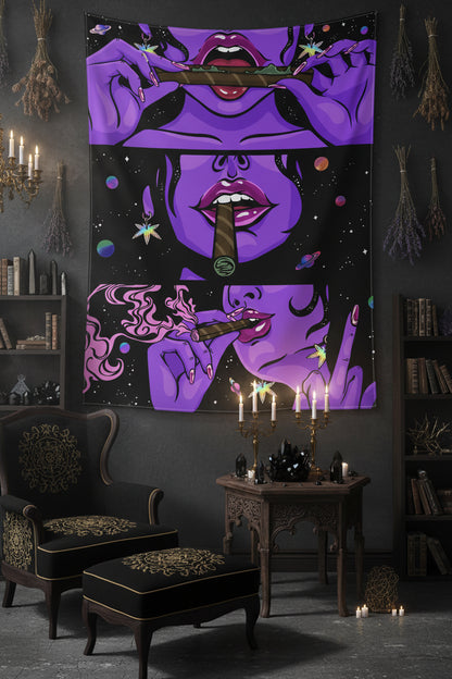 Purple tapestry with a stylized face design in a room with a yellow chair and small table.