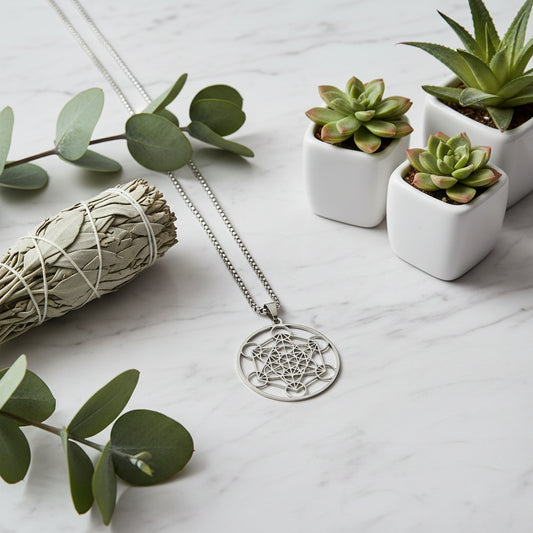 Silver pendant with intricate design on a black textured background