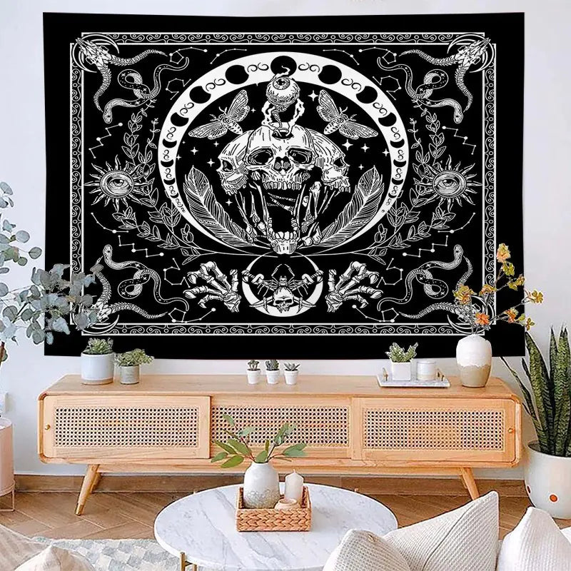 Decorative tapestry with a skull design hanging above a wooden console table in a living room.