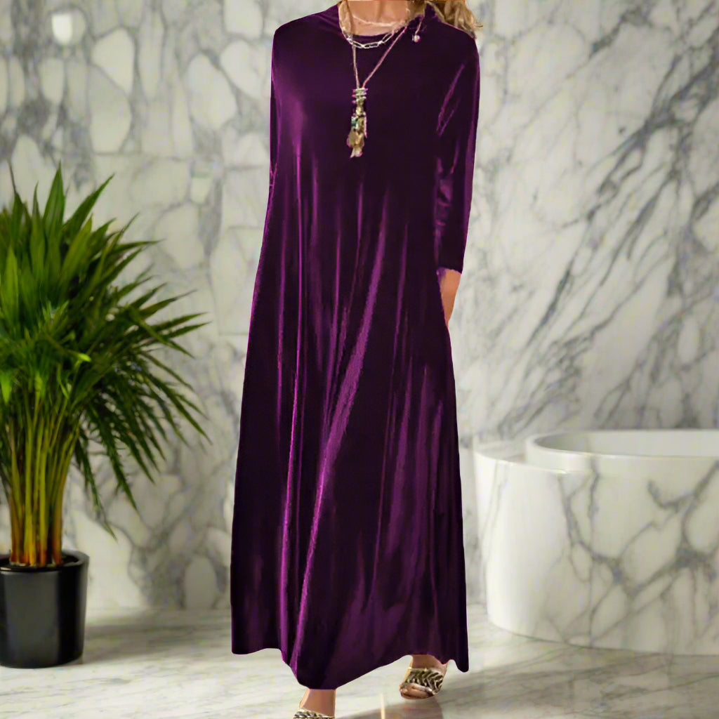 Purple dress worn by a person on a white background
