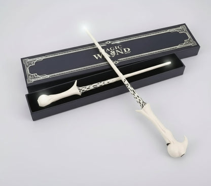 White magic wand with decorative handle and packaging on a white background
