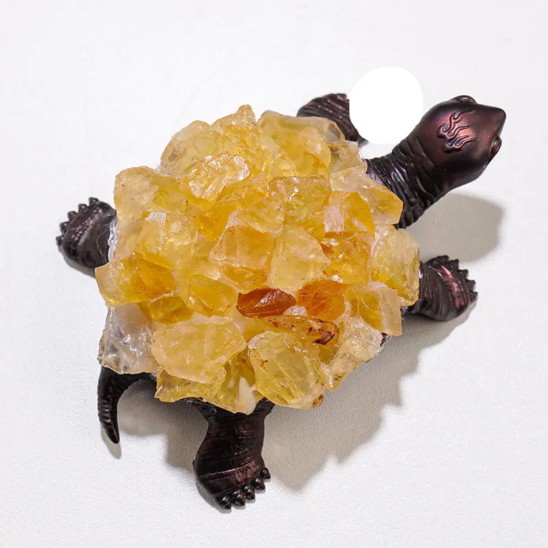Crystal turtle with yellow crystal on a white background