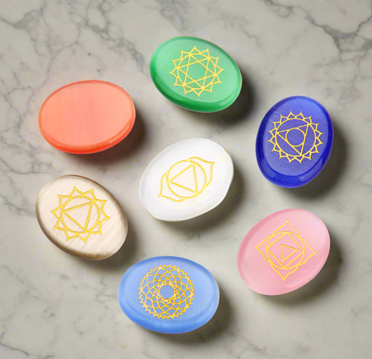 Set of colorful stones with geometric designs on a white background