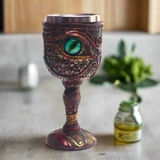 Decorative goblet with eye design on a white background