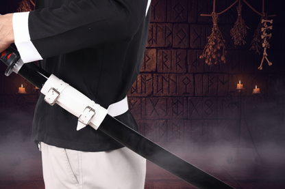 Person holding a sword with a white belt against a light gray background