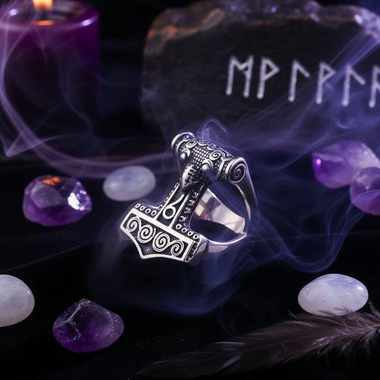 Silver Thor's hammer pendant on a dark background