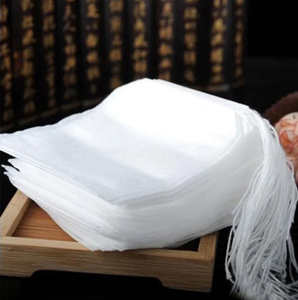 White scarf with tassels on a wooden stand against a dark background with text.