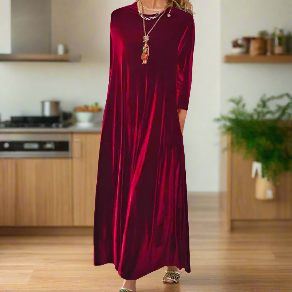 Red velvet dress worn by a person on a white background
