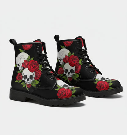Black boots with skull and rose design worn by a person.
