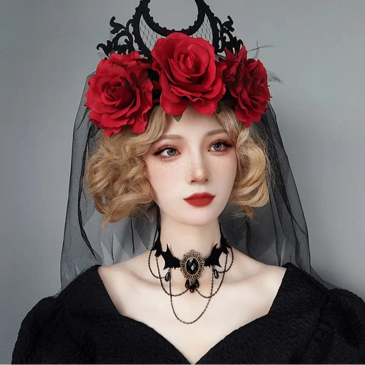 Person wearing a black headpiece with red roses and a black veil, with 'Evil LaMo' branding.