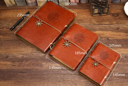 Three brown leather journals with star designs on a wooden surface, showing measurements.