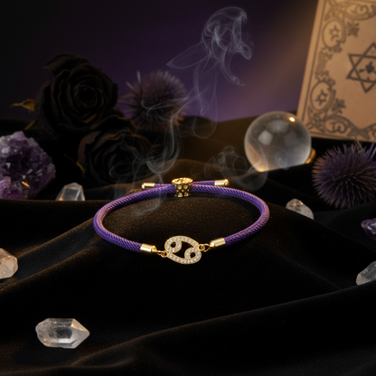 Purple bracelet with gold accents on a white background