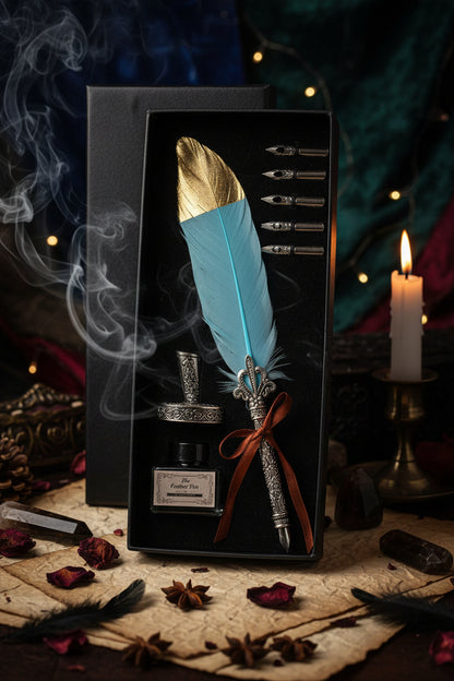Decorative feather pen set with ink bottle and nibs in a box on a wooden surface.