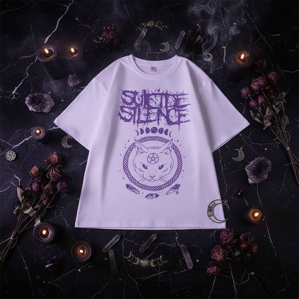 White t-shirt with purple graphic design on a checkered surface