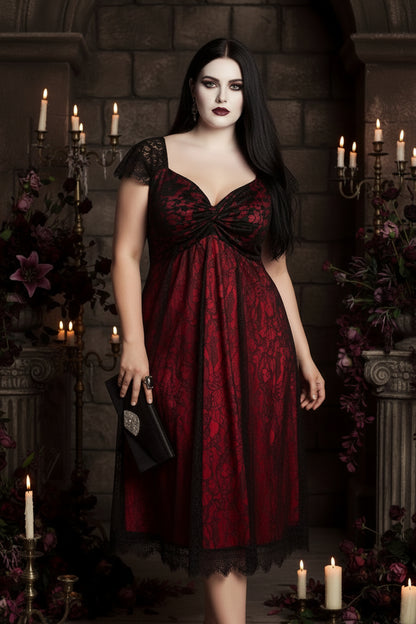 Woman wearing a red and black lace dress against a neutral background