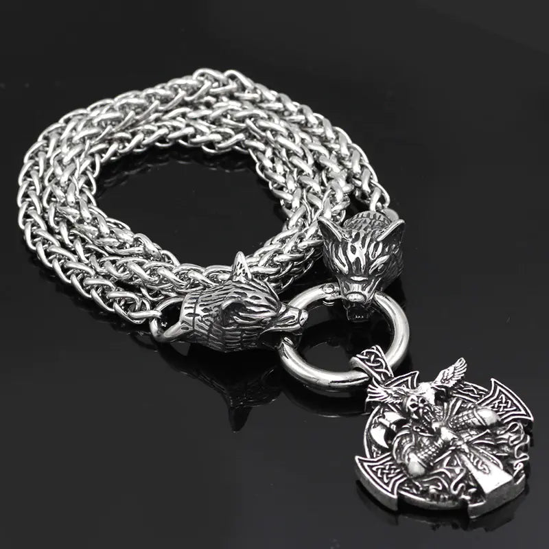 Silver chain bracelet with wolf head and warrior pendant on a black background