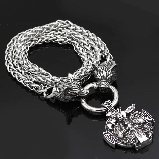 Silver chain bracelet with wolf head and warrior pendant on a black background