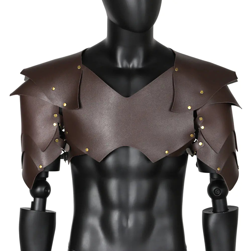 Brown leather shoulder armor with gold studs on a black mannequin