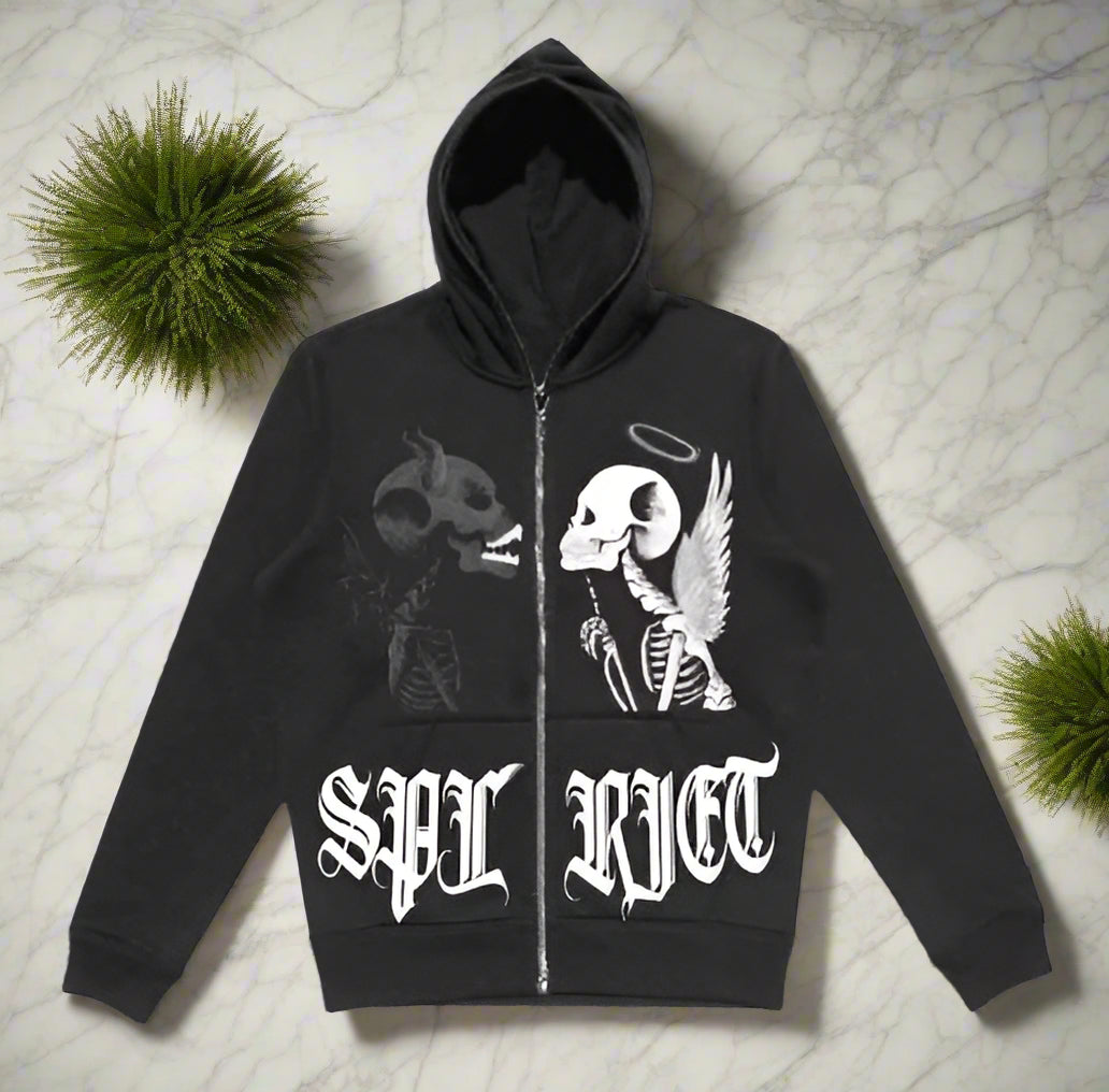 Black hoodie with skeleton design and 'SPL RICT' text on a gray surface