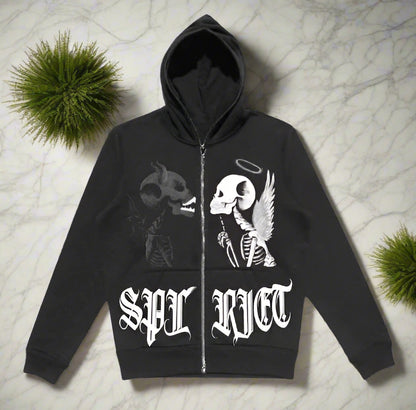 Black hoodie with skeleton design and 'SPL RICT' text on a gray surface