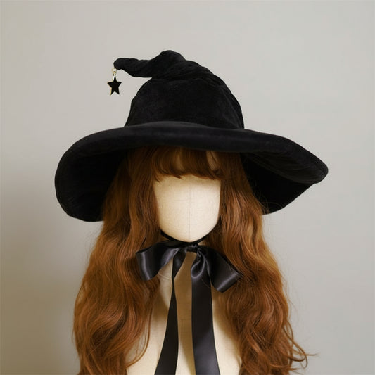 Black witch hat with a star on top worn by a mannequin with red hair and a black bow.