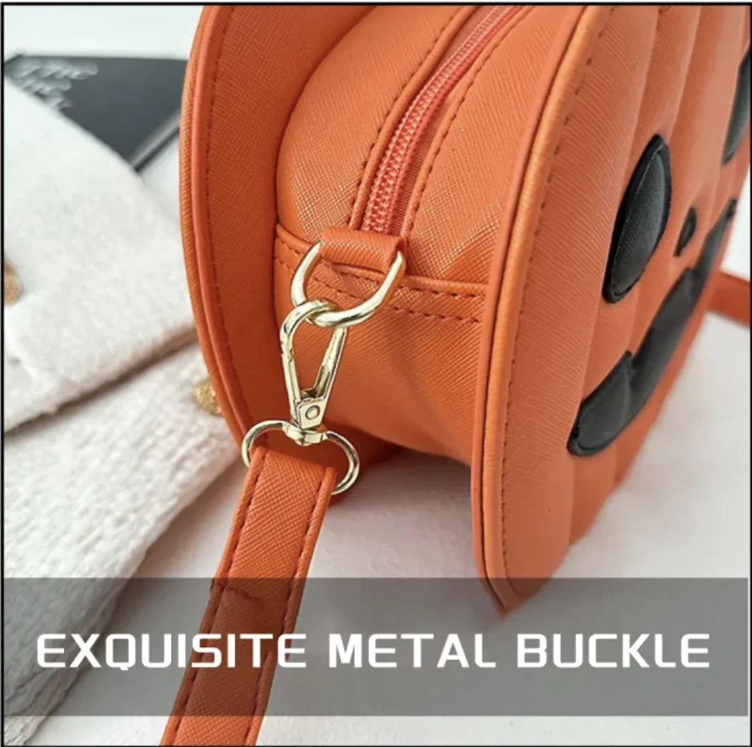 Orange handbag with an exquisite metal buckle on a light background