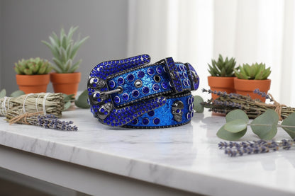 Blue studded belt with a silver buckle on a white background