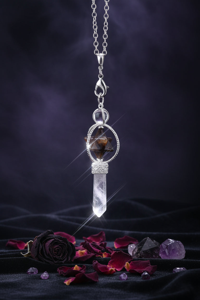 Jewelry set with a star-shaped pendant and crystal-like element on a black background