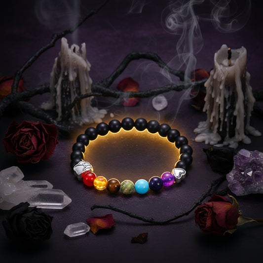 Black beaded bracelet with colorful beads and silver charms on a white background