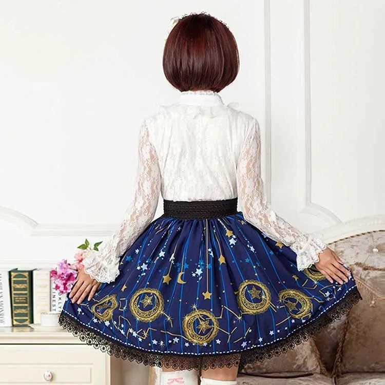 Person wearing a blue skirt with star and moon designs, standing in a room.