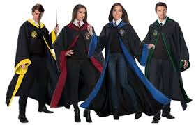 Four people in Harry Potter-themed robes with colorful scarves.