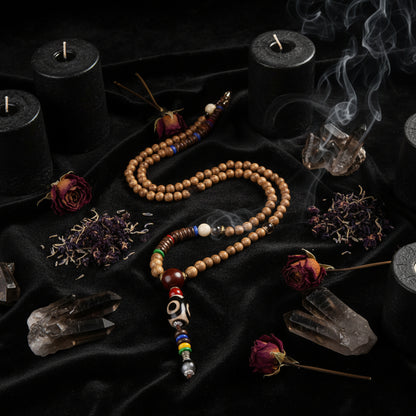 Beaded necklace with colorful beads on a textured fabric background
